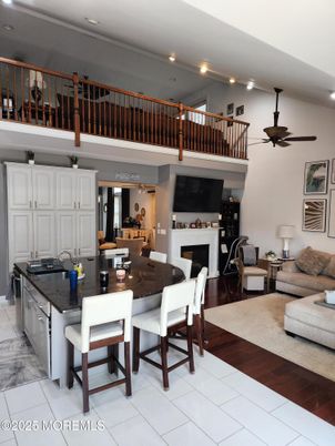 Dining room, Fireplace, Interior, Kitchen, Living room, Recessed Lighting, Wood Texture Flooring
