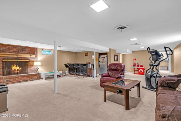 Fireplace, Fitness Equipment, Interior, Living room, Recessed Lighting, Stone Walls