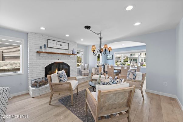 Chandelier, Dining room, Fireplace, Interior, Living room, Recessed Lighting, Stone Walls, Wood Texture Flooring