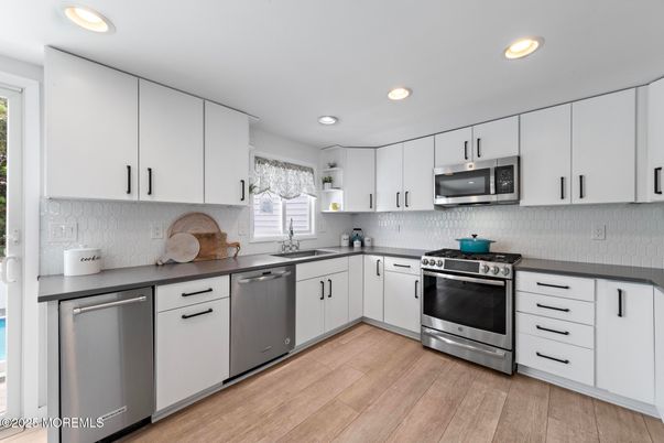 Interior, Kitchen, Recessed Lighting, Stainless Steel Appliances, Wood Texture Flooring