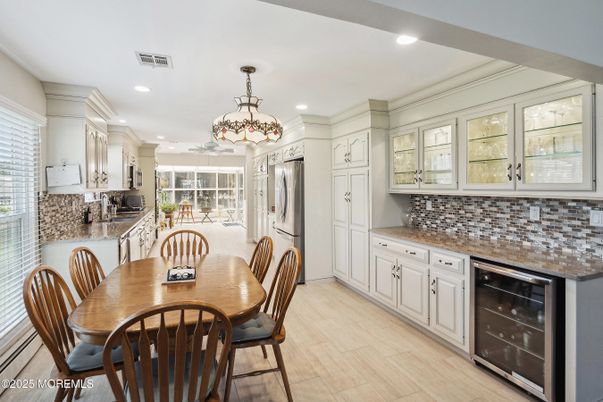 Dining room, Interior, Kitchen, Pendant Lights, Recessed Lighting, Stainless Steel Appliances, Wood Texture Flooring
