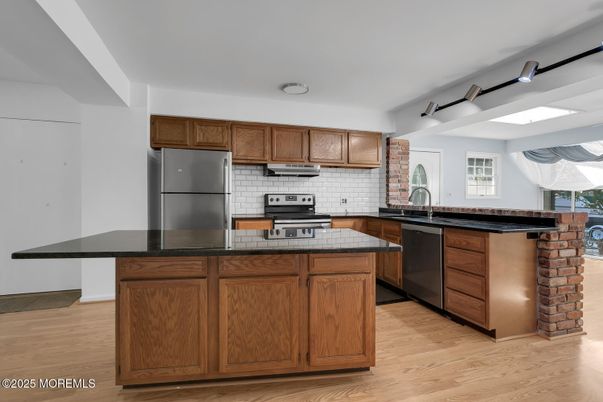 Interior, Kitchen, Stainless Steel Appliances, Tile Countertops, Wood Texture Flooring