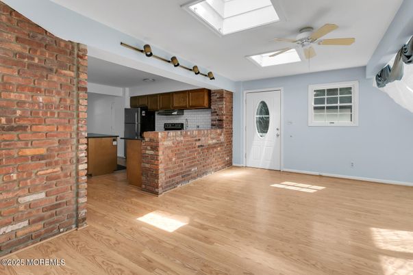 Empty room, Interior, Kitchen, Stainless Steel Appliances, Stone Walls, Wood Texture Flooring