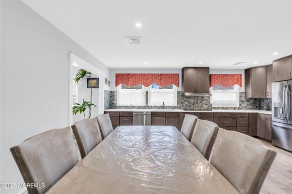 Dining room, Interior, Kitchen, Recessed Lighting, Stainless Steel Appliances, Wood Texture Flooring