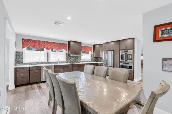 Dining room, Interior, Kitchen, Recessed Lighting, Stainless Steel Appliances, Wood Texture Flooring