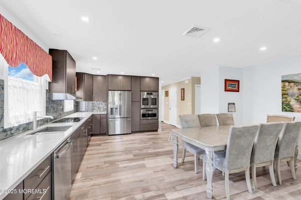 Dining room, Interior, Kitchen, Recessed Lighting, Stainless Steel Appliances, Wood Texture Flooring
