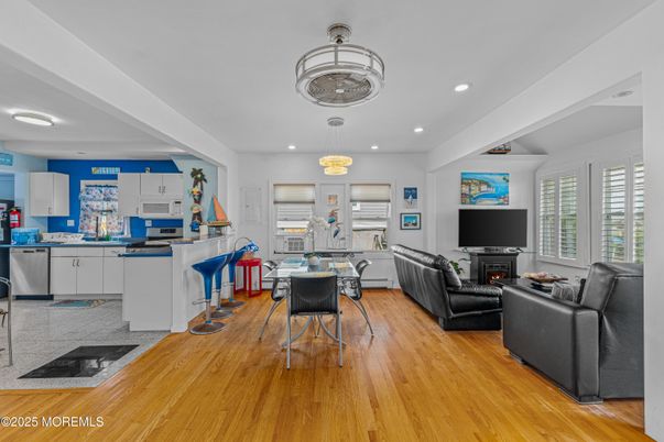 Chandelier, Dining room, Fireplace, Interior, Living room, Recessed Lighting, Wood Texture Flooring