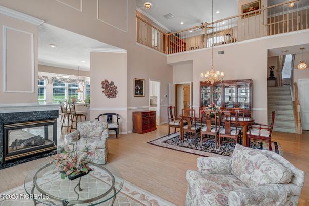 Chandelier, Dining room, Fireplace, Interior, Living room, Pendant Lights, Recessed Lighting, Wood Texture Flooring
