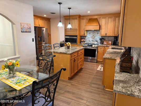 Dining room, Interior, Kitchen, Pendant Lights, Recessed Lighting, Stainless Steel Appliances, Wood Texture Flooring