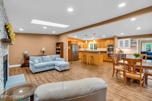 Dining room, Fireplace, Interior, Kitchen, Living room, Pendant Lights, Recessed Lighting, Stainless Steel Appliances, Wood Texture Flooring