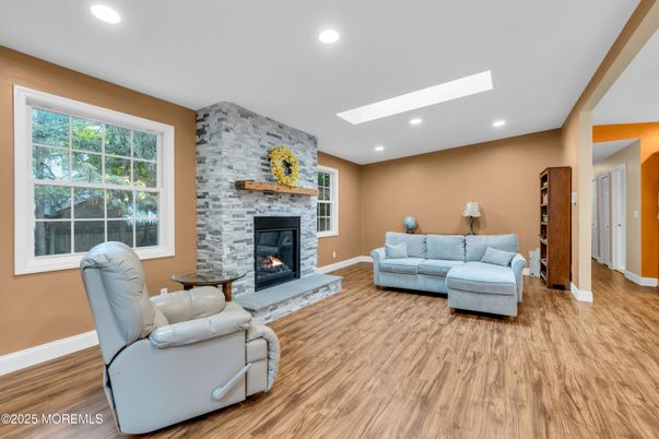 Fireplace, Interior, Living room, Recessed Lighting, Stone Walls, Wood Texture Flooring