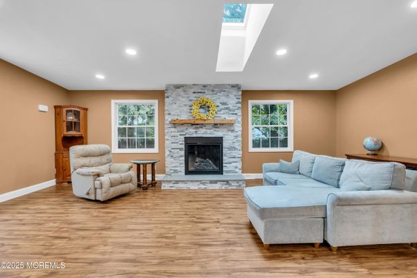 Fireplace, Interior, Living room, Recessed Lighting, Stone Walls, Wood Texture Flooring