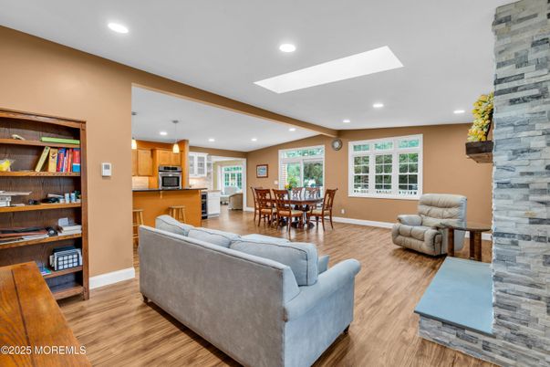 Dining room, Interior, Kitchen, Living room, Recessed Lighting, Stainless Steel Appliances, Stone Walls, Wooden Beams, Wood Texture Flooring