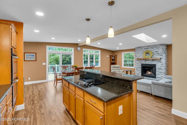 Dining room, Fireplace, Interior, Kitchen, Living room, Pendant Lights, Recessed Lighting, Stone Walls, Wood Texture Flooring