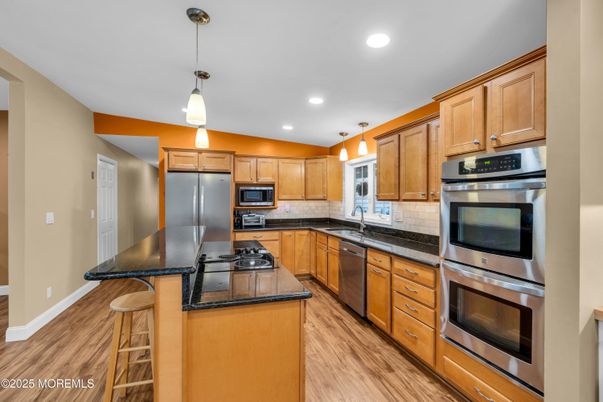 Interior, Kitchen, Pendant Lights, Recessed Lighting, Stainless Steel Appliances, Wood Texture Flooring