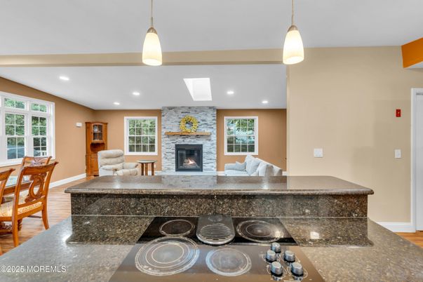 Fireplace, Interior, Pendant Lights, Recessed Lighting, Stone Walls, Wood Texture Flooring