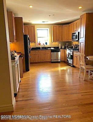 Dining room, Interior, Kitchen, Recessed Lighting, Stainless Steel Appliances, Wood Texture Flooring