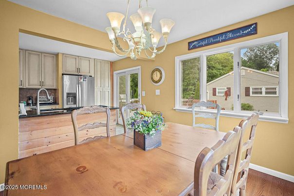 Chandelier, Dining room, Interior, Kitchen, Stainless Steel Appliances, Wood Texture Flooring