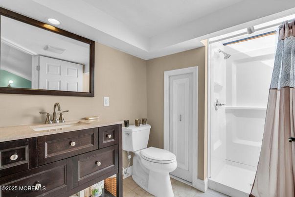Bathroom, Dual Sink Vanities, Interior, Recessed Lighting, Wood Texture Flooring