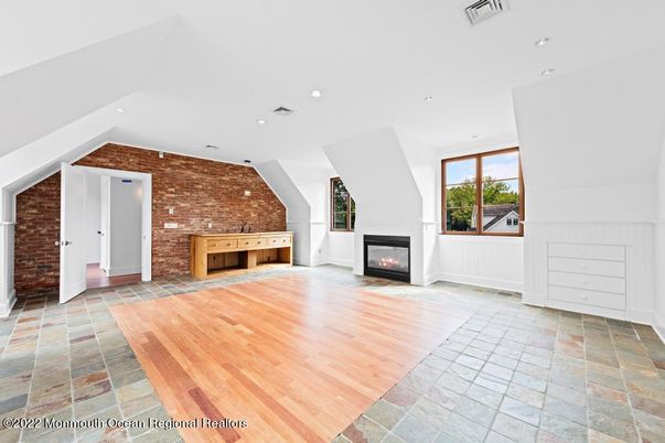 Empty room, Fireplace, Interior, Recessed Lighting, Stone Walls, Wood Texture Flooring