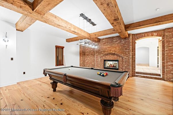 Billiard Table, Fireplace, Game Room, Interior, Pendant Lights, Recessed Lighting, Stone Walls, Wooden Beams, Wood Texture Flooring