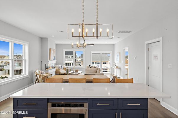 Dining room, Interior, Kitchen, Living room, Pendant Lights, Recessed Lighting, Stainless Steel Appliances, Wood Texture Flooring