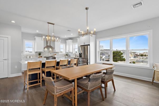 Dining room, Interior, Kitchen, Pendant Lights, Recessed Lighting, Stainless Steel Appliances, Wood Texture Flooring