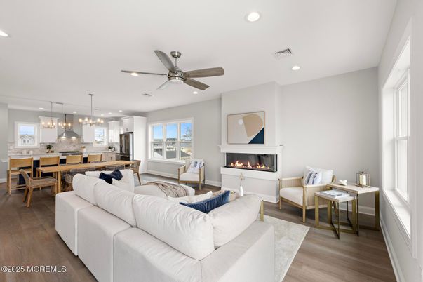 Dining room, Fireplace, Interior, Kitchen, Living room, Pendant Lights, Recessed Lighting, Stainless Steel Appliances, Wood Texture Flooring
