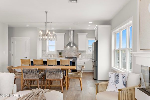 Dining room, Interior, Kitchen, Pendant Lights, Recessed Lighting, Stainless Steel Appliances, Wood Texture Flooring