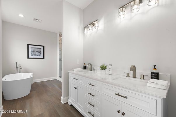Bathroom, Dual Sink Vanities, Free Standing Baths, Interior, Recessed Lighting, Wood Texture Flooring