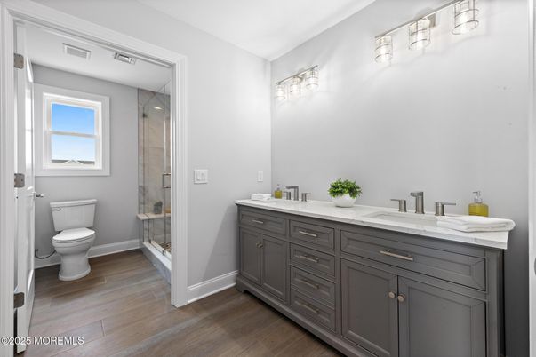 Bathroom, Dual Sink Vanities, Glass Shower, Interior, Wood Texture Flooring