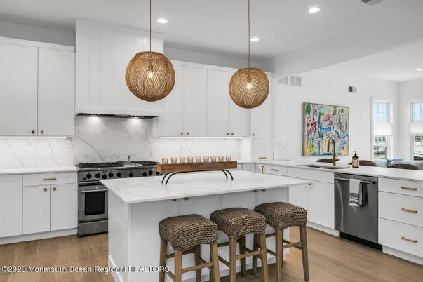 Interior, Kitchen, Marble Walls, Pendant Lights, Recessed Lighting, Stainless Steel Appliances, Wood Texture Flooring