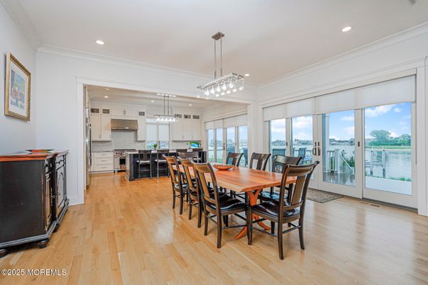 Dining room, Interior, Kitchen, Pendant Lights, Recessed Lighting, Stainless Steel Appliances, Water, Wood Texture Flooring