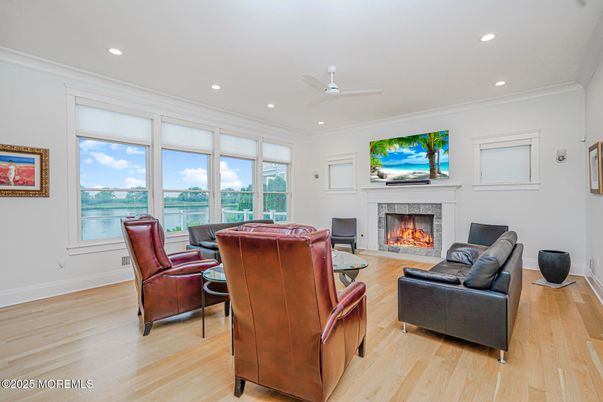 Fireplace, Interior, Living room, Recessed Lighting, Water, Wood Texture Flooring