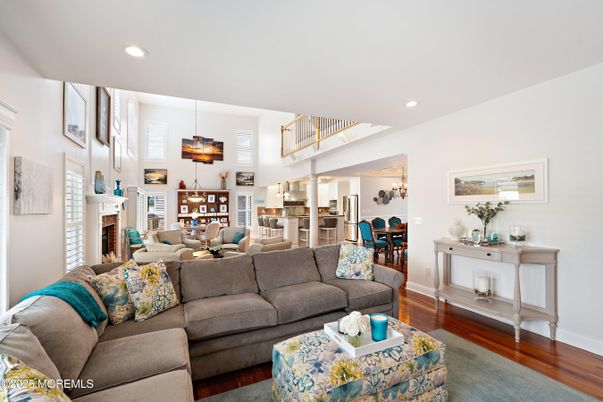 Dining room, Fireplace, Interior, Living room, Pendant Lights, Recessed Lighting, Wood Texture Flooring