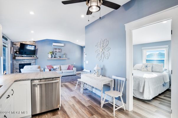 Bedroom, Fireplace, Interior, Kitchen, Living room, Recessed Lighting, Wood Texture Flooring