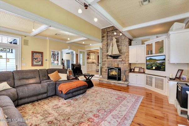 Fireplace, Interior, Living room, Pendant Lights, Recessed Lighting, Stone Walls, Wood Texture Flooring