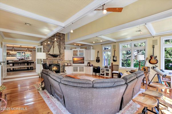 Dining room, Fireplace, Interior, Kitchen, Living room, Pendant Lights, Stone Walls, Wood Texture Flooring