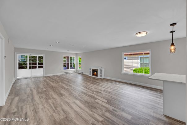 Empty room, Fireplace, Interior, Pendant Lights, Recessed Lighting, Wood Texture Flooring