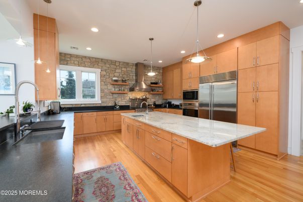 Interior, Kitchen, Pendant Lights, Recessed Lighting, Stainless Steel Appliances, Stone Walls, Wood Texture Flooring