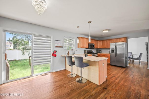 Dining room, Interior, Kitchen, Pendant Lights, Stainless Steel Appliances, Wood Texture Flooring