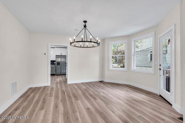 Chandelier, Empty room, Interior, Stainless Steel Appliances, Wood Texture Flooring