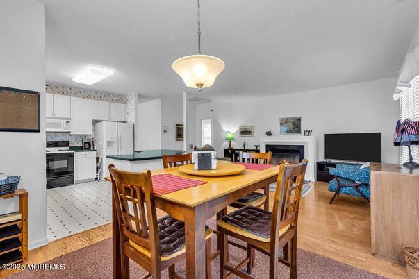Dining room, Fireplace, Interior, Kitchen, Pendant Lights, Wood Texture Flooring