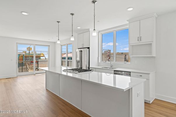 Interior, Kitchen, Pendant Lights, Recessed Lighting, Stainless Steel Appliances, Wood Texture Flooring