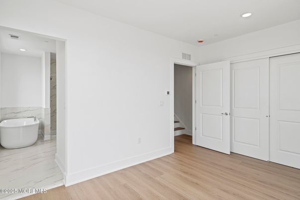 Bathroom, Free Standing Baths, Interior, Marble, Recessed Lighting, Wood Texture Flooring