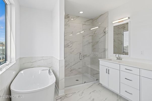 Bathroom, Free Standing Baths, Glass Shower, Interior, Marble, Marble Walls, Recessed Lighting