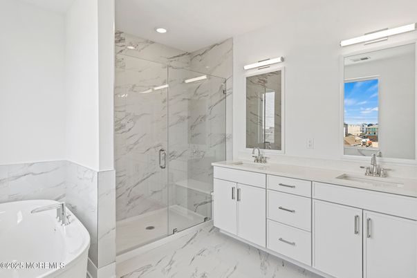 Bathroom, Dual Sink Vanities, Glass Shower, Interior, Marble, Marble Walls, Recessed Lighting