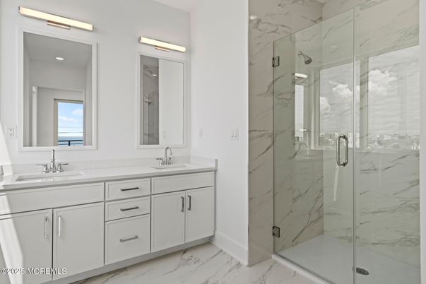 Bathroom, Dual Sink Vanities, Glass Shower, Interior, Marble, Marble Walls, Recessed Lighting