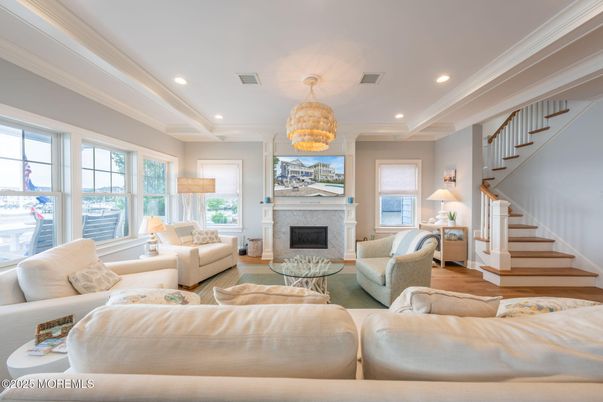 Chandelier, Fireplace, Interior, Living room, Pendant Lights, Recessed Lighting, Wood Texture Flooring