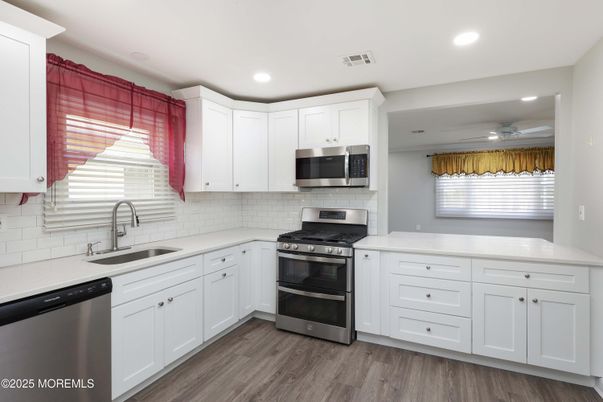 Interior, Kitchen, Recessed Lighting, Stainless Steel Appliances, Wood Texture Flooring